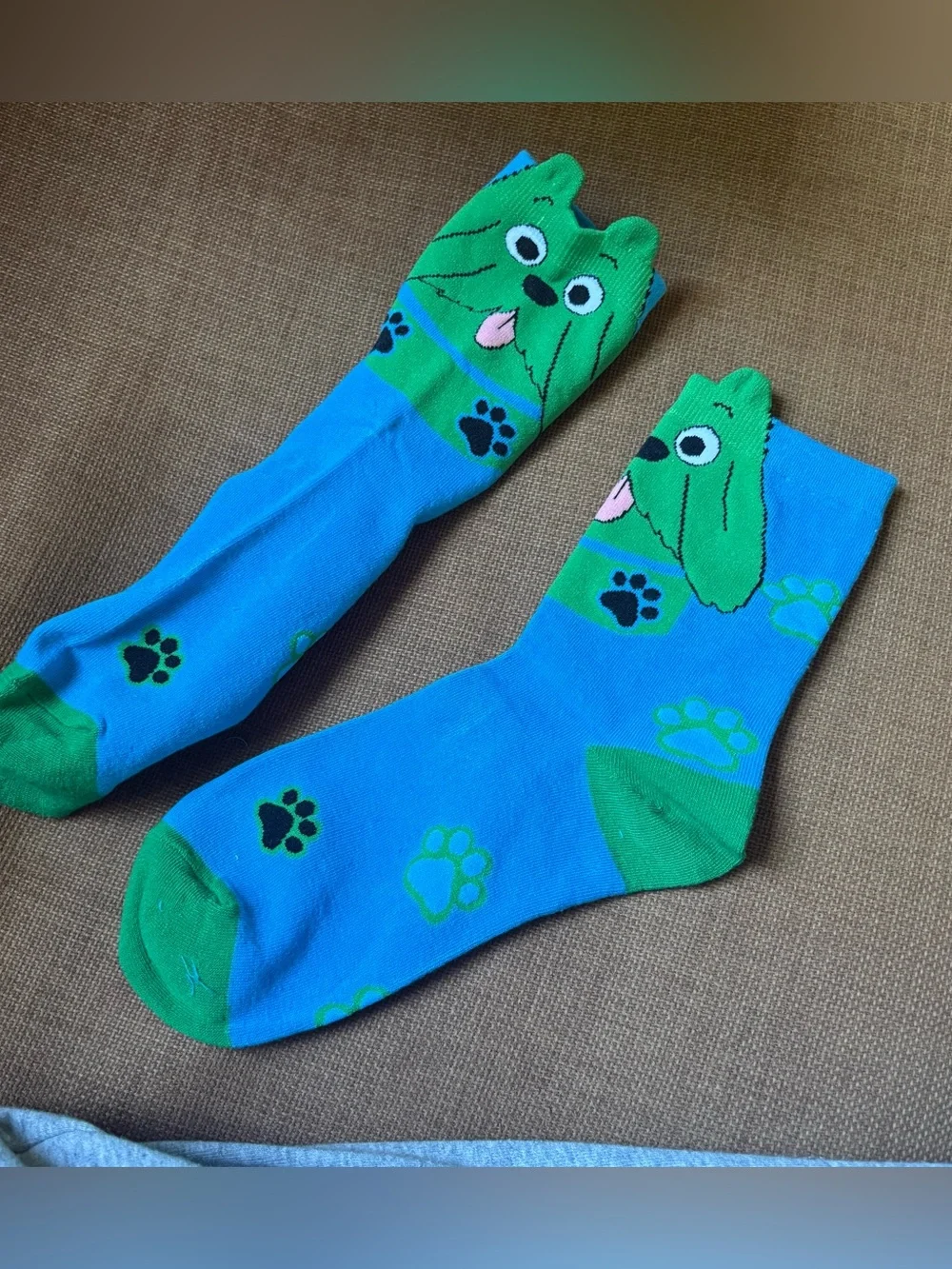 Blue & green dog socks with green dog faces and black paw prints #doglovers #paw
